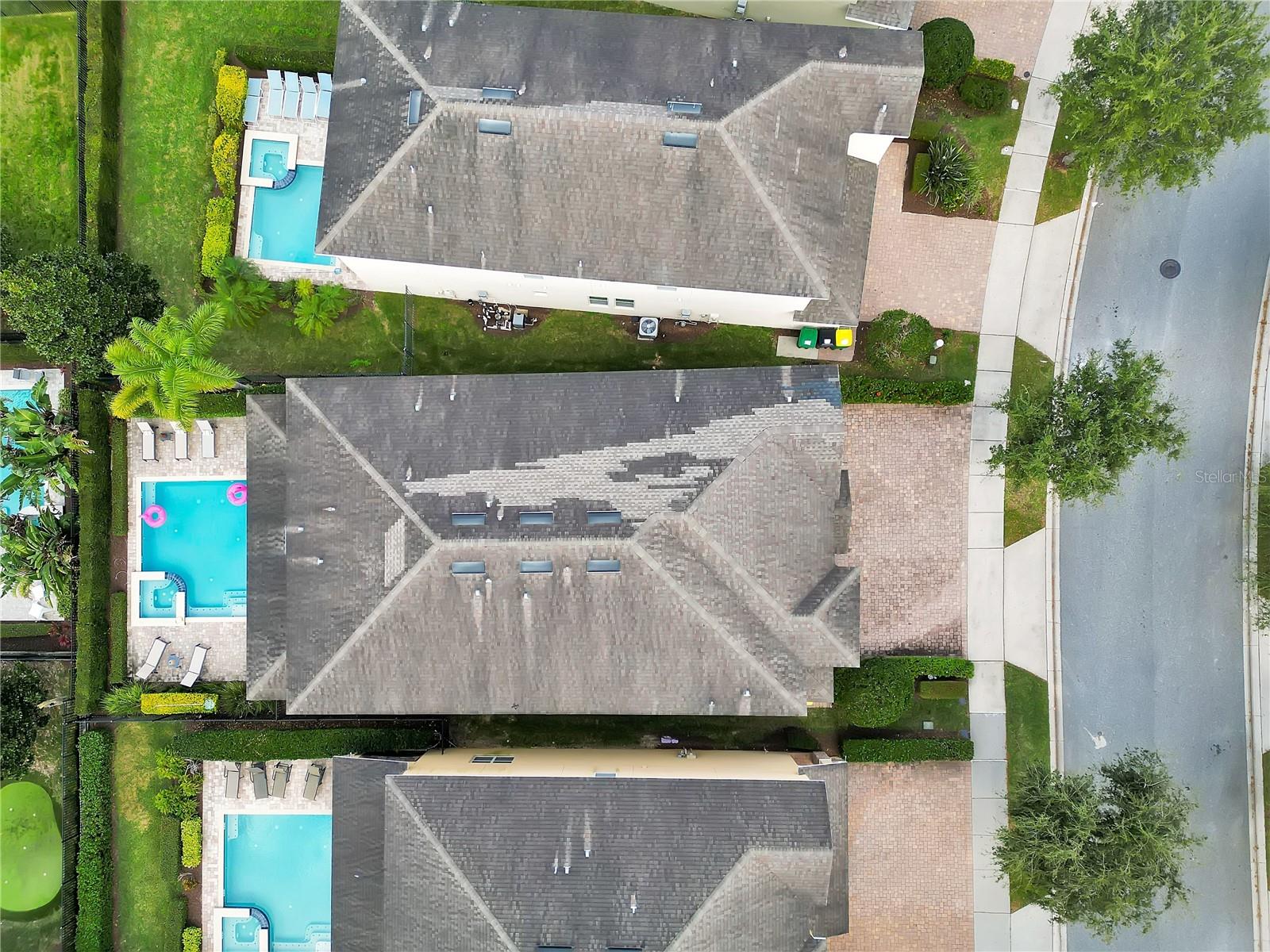 Bird’s-eye view highlighting the property’s generous lot and well-maintained surroundings - 631 LASSO DR, KISSIMMEE