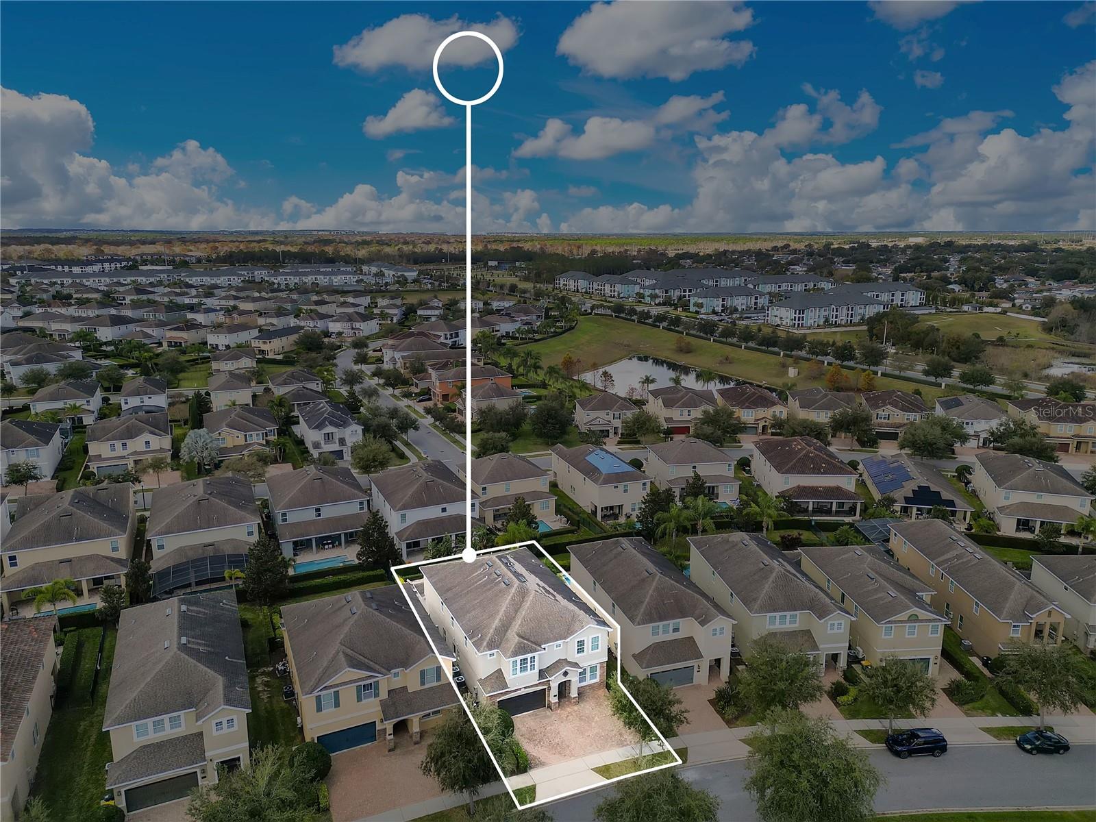 Elevated drone perspective emphasizing the home’s location within this sought-after short-term rental community - 631 LASSO DR, KISSIMMEE