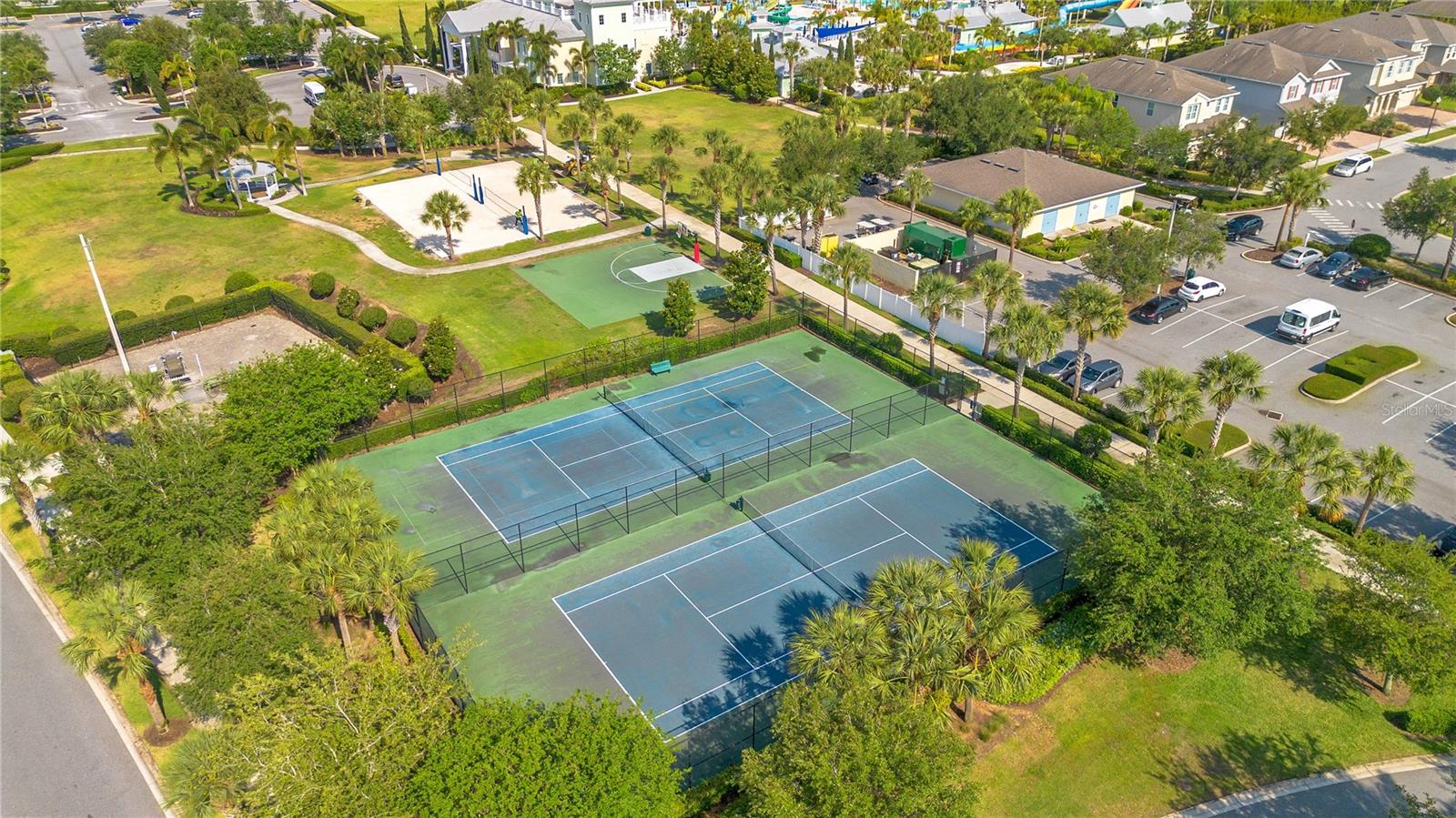 Community tennis courts and recreational facilities enhancing guest appeal and rental value - 631 LASSO DR, KISSIMMEE