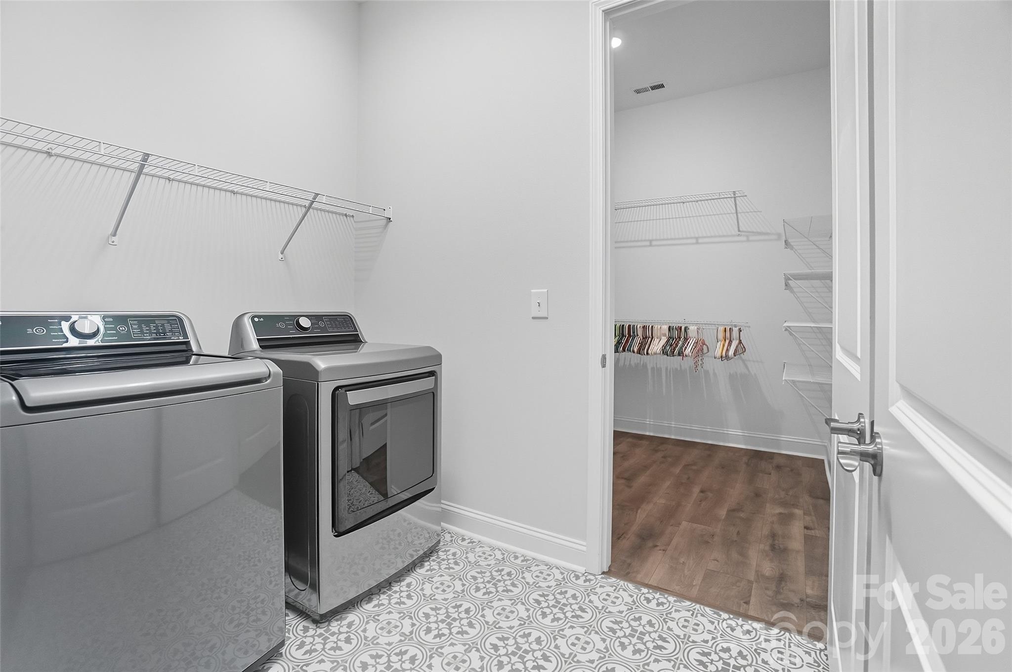 Laundry room with access to the primary walk in closet - 219 Pintail Drive, Monroe