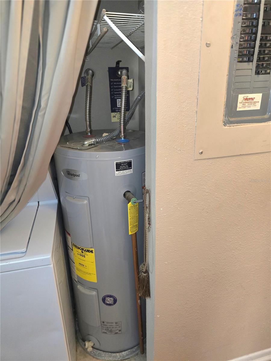 Water heater in hall to 2nd bedroom and bath. - 4140 PASSPORT LN #101, NEW PORT RICHEY
