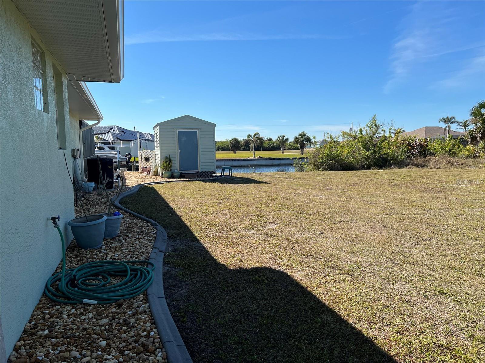 side Yard - 9458 MELODY CIR, PORT CHARLOTTE