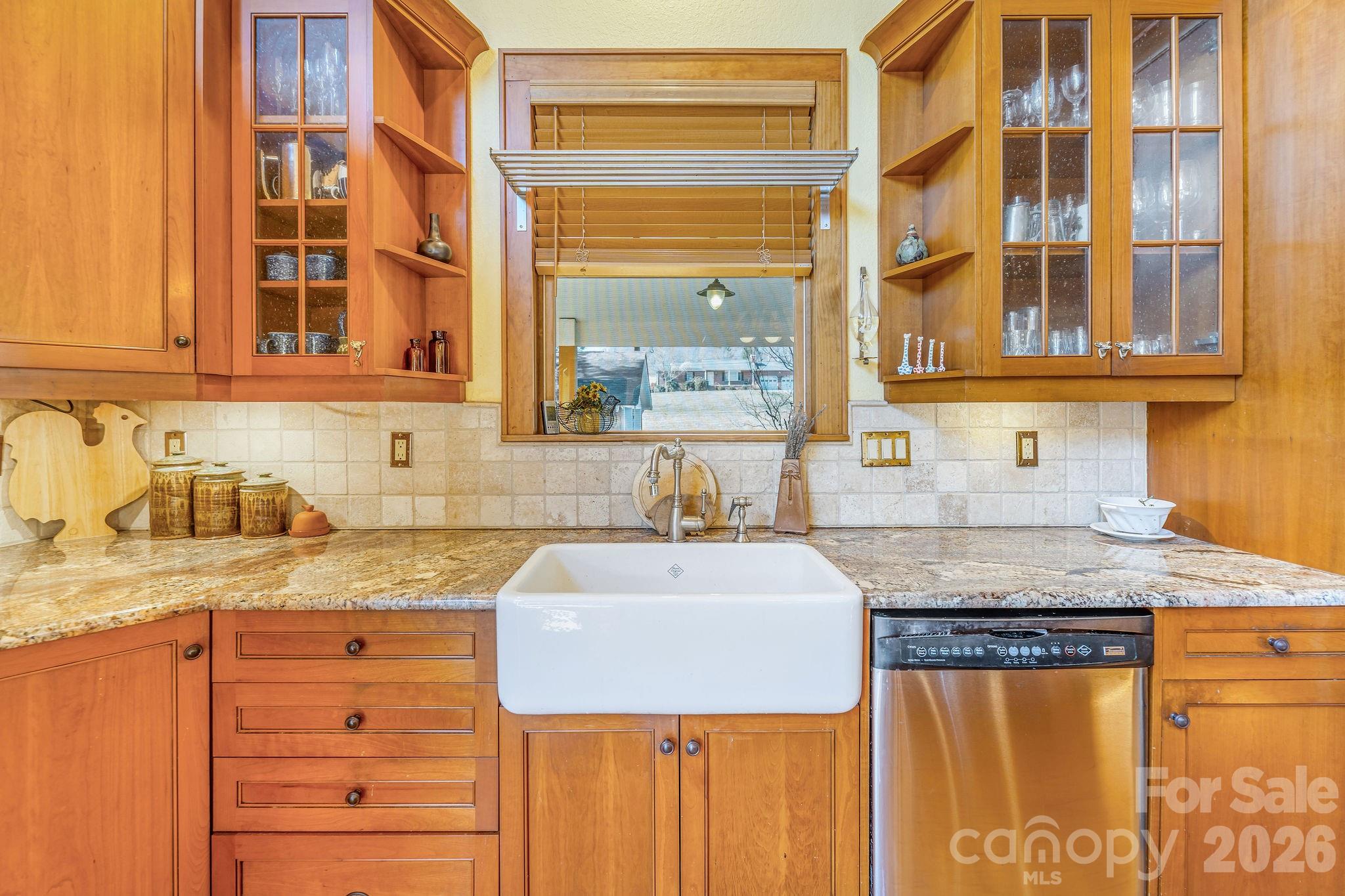 Farmhouse sink beautifully contrasting earth granite countertops. - 22 Mountain Spring Lane, Canton