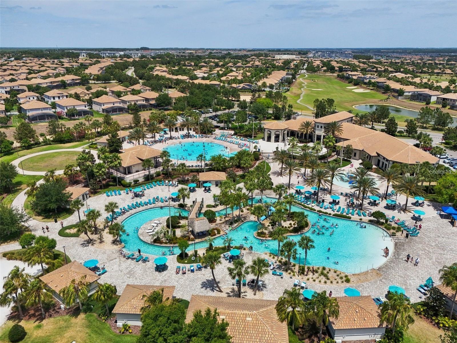 Oasis Club with lazy river, community pool, kids splash zone, two bars, restaurant, arcade, gym, and movie theater - 1301 GLENEAGLES LN, DAVENPORT