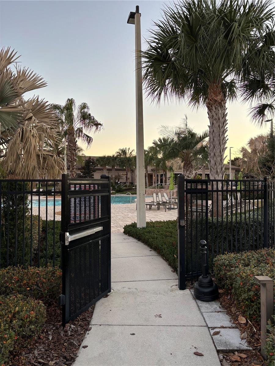 Gated back entrance for residents only opened by key card - 1301 GLENEAGLES LN, DAVENPORT