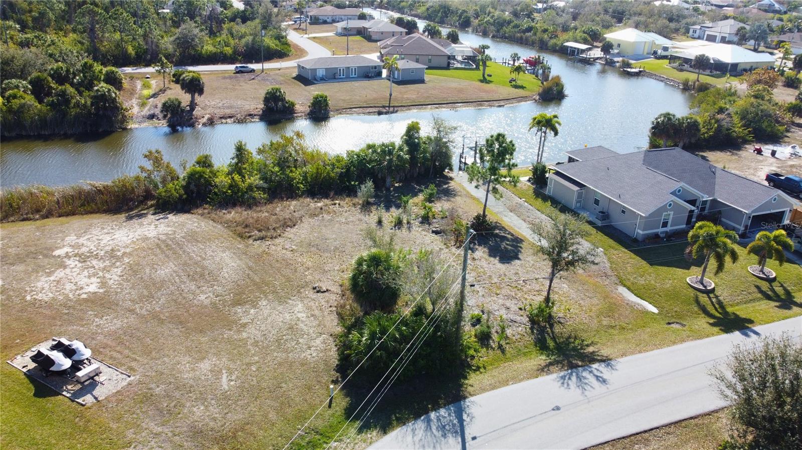 Aerial view of residential area featuring a nearby body of water - 9548 ATTICA CIR, PORT CHARLOTTE