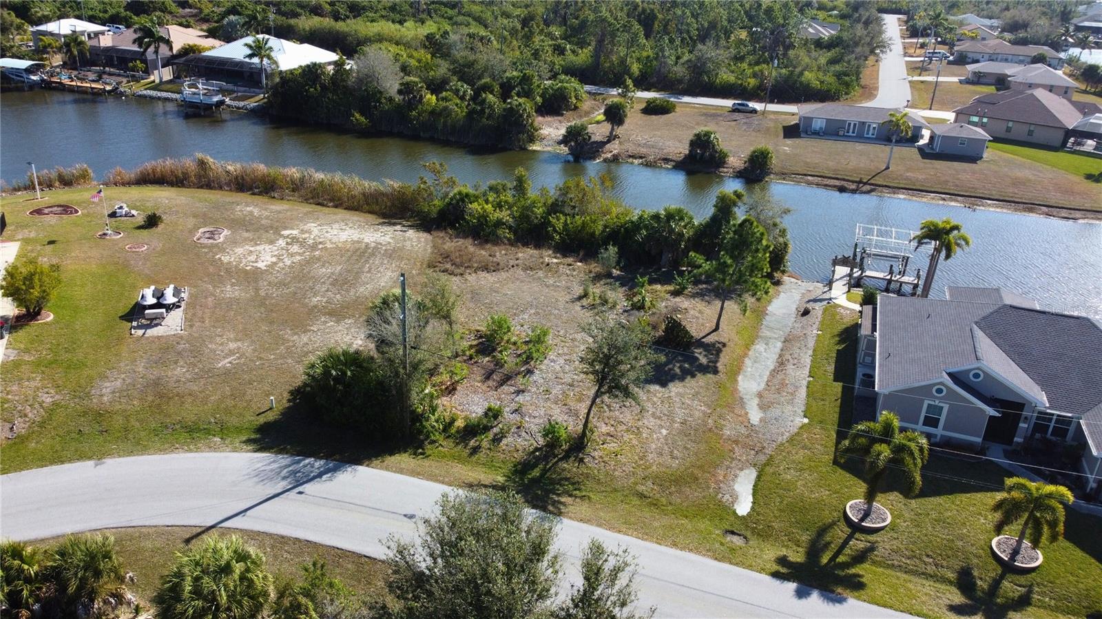 Aerial view of residential area featuring a nearby body of water - 9548 ATTICA CIR, PORT CHARLOTTE