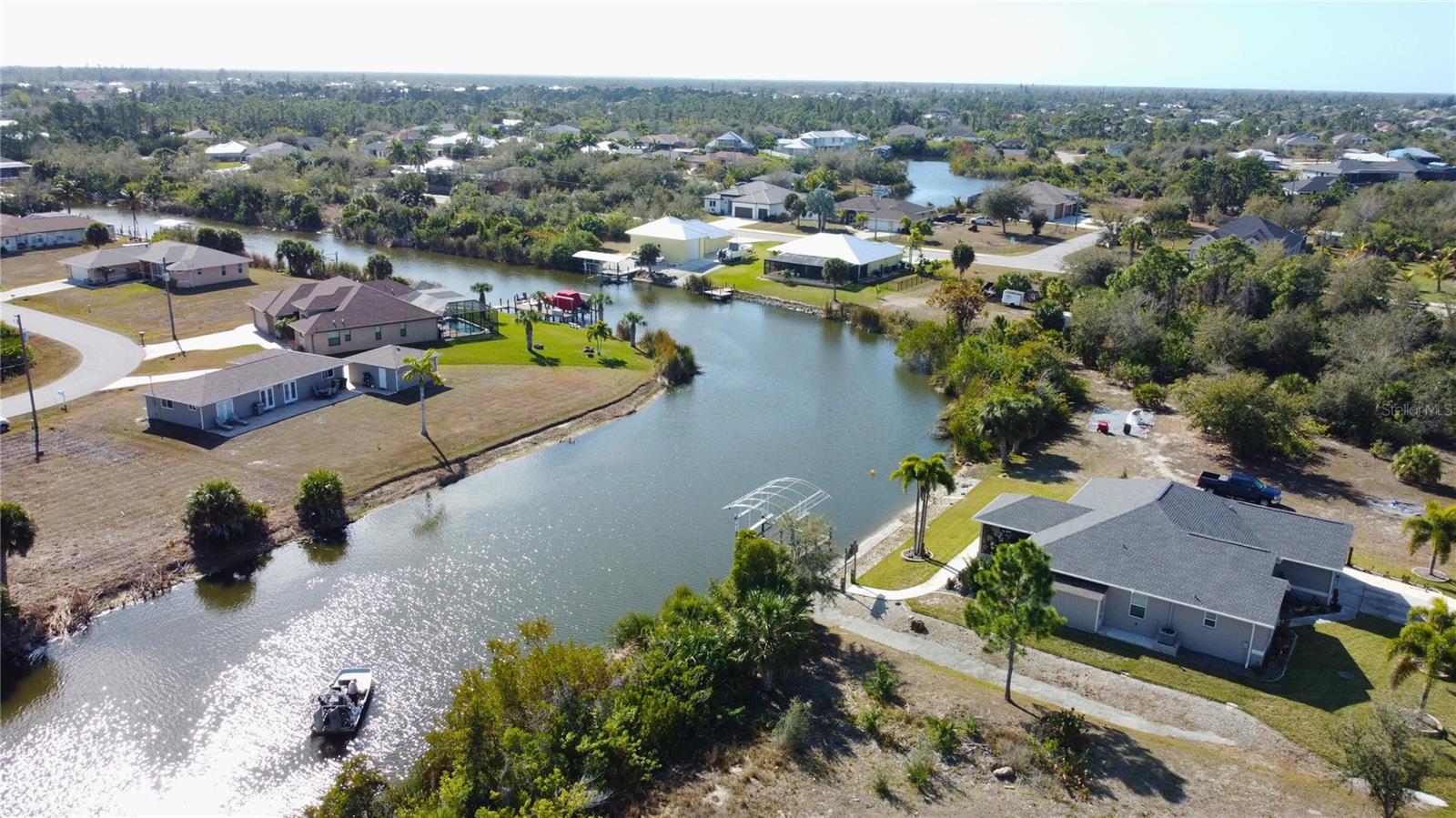 Aerial perspective of suburban area with a large body of water - 9548 ATTICA CIR, PORT CHARLOTTE