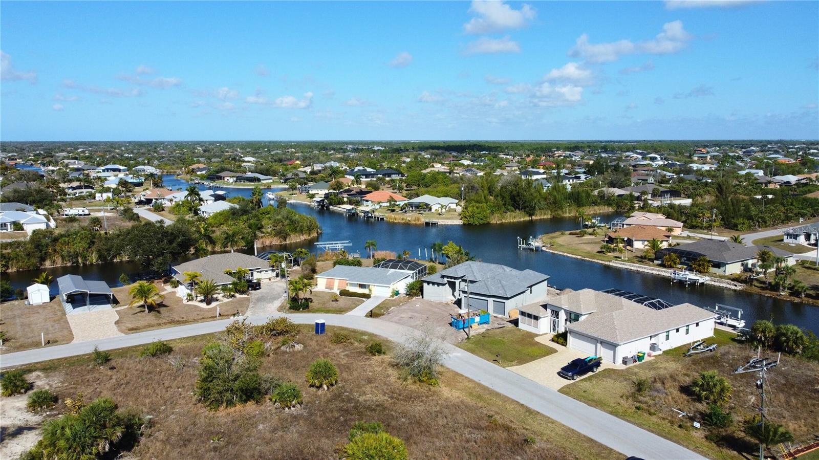 Aerial view of residential area with a large body of water - 9548 ATTICA CIR, PORT CHARLOTTE