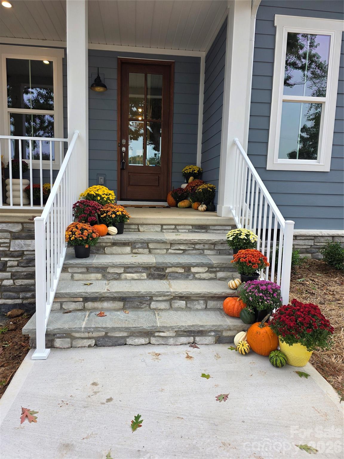 The front porch is an open canvas to add comfortable seating, a swing, and tasteful decorations, creating an inviting atmosphere. - 4265 Candlewood Drive, Sherrills Ford