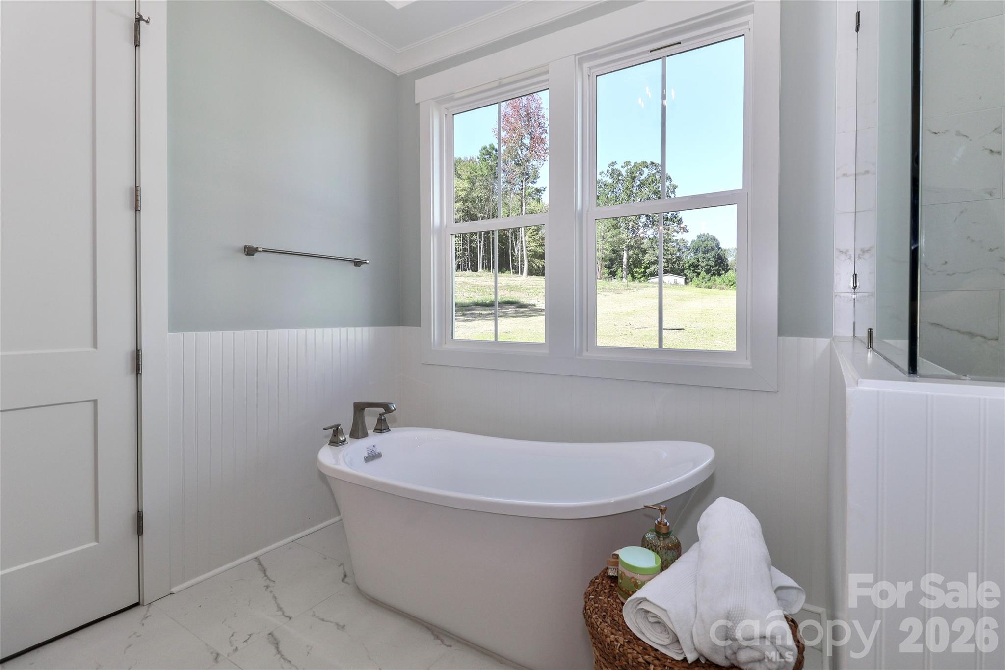 The primary bathroom is all about luxury and relaxation. - 4265 Candlewood Drive, Sherrills Ford