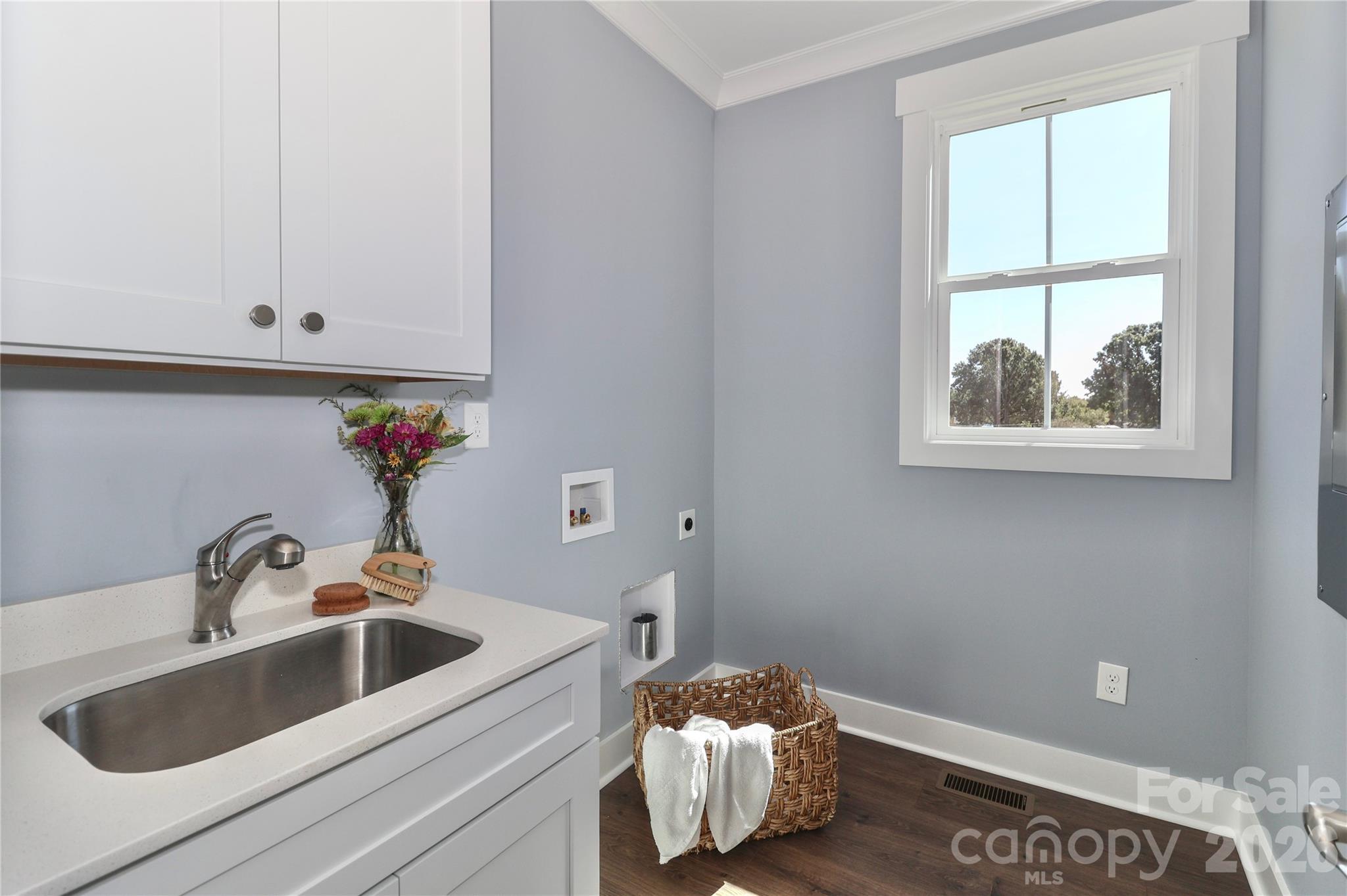The conveniently placed laundry room offers practicality and ease, streamlining household chores. - 4265 Candlewood Drive, Sherrills Ford