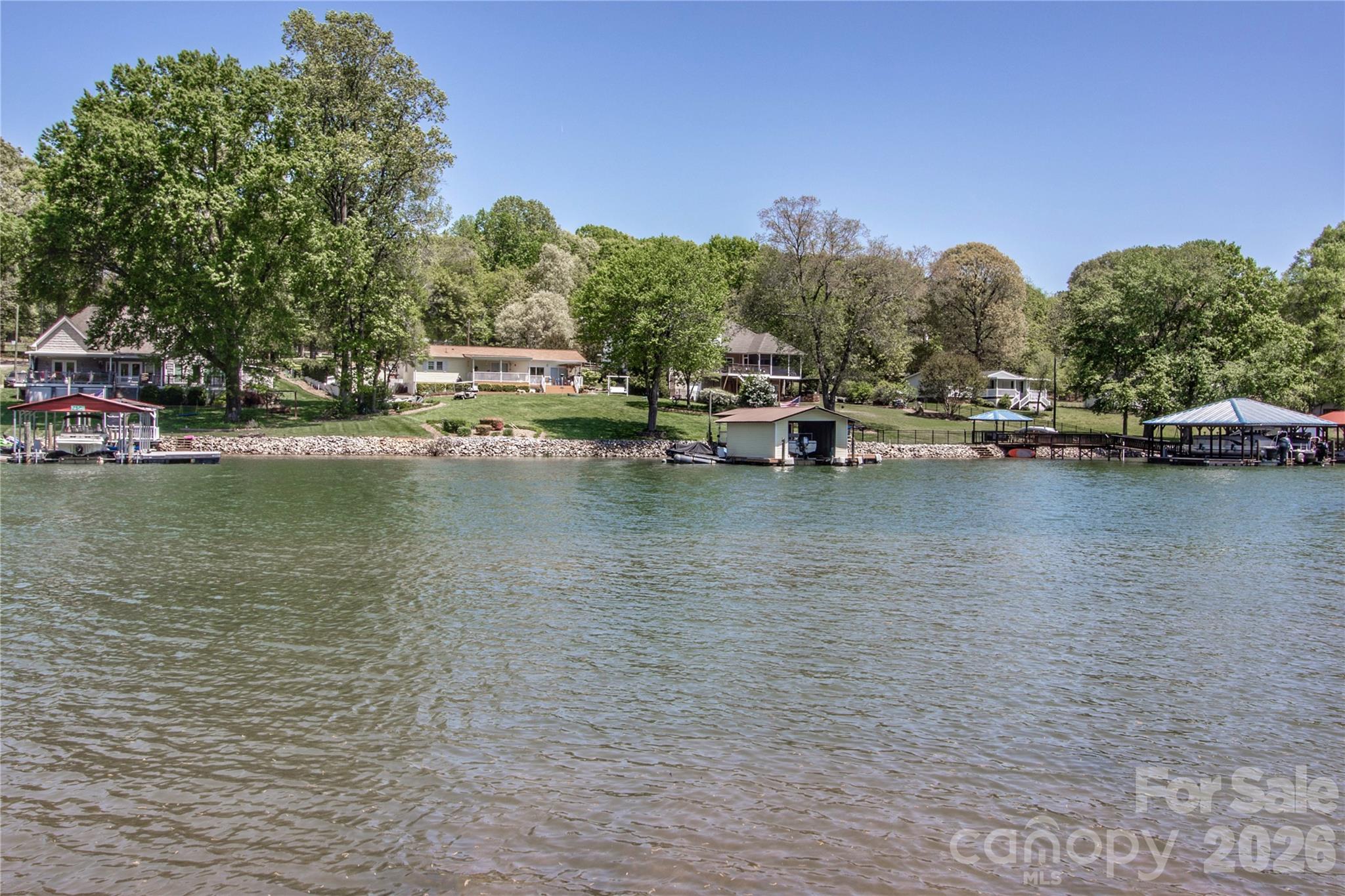 Enjoy the picturesque setting, and easy access to the lake, making it ideal for those who enjoy a tranquil lakeside lifestyle. - 4265 Candlewood Drive, Sherrills Ford