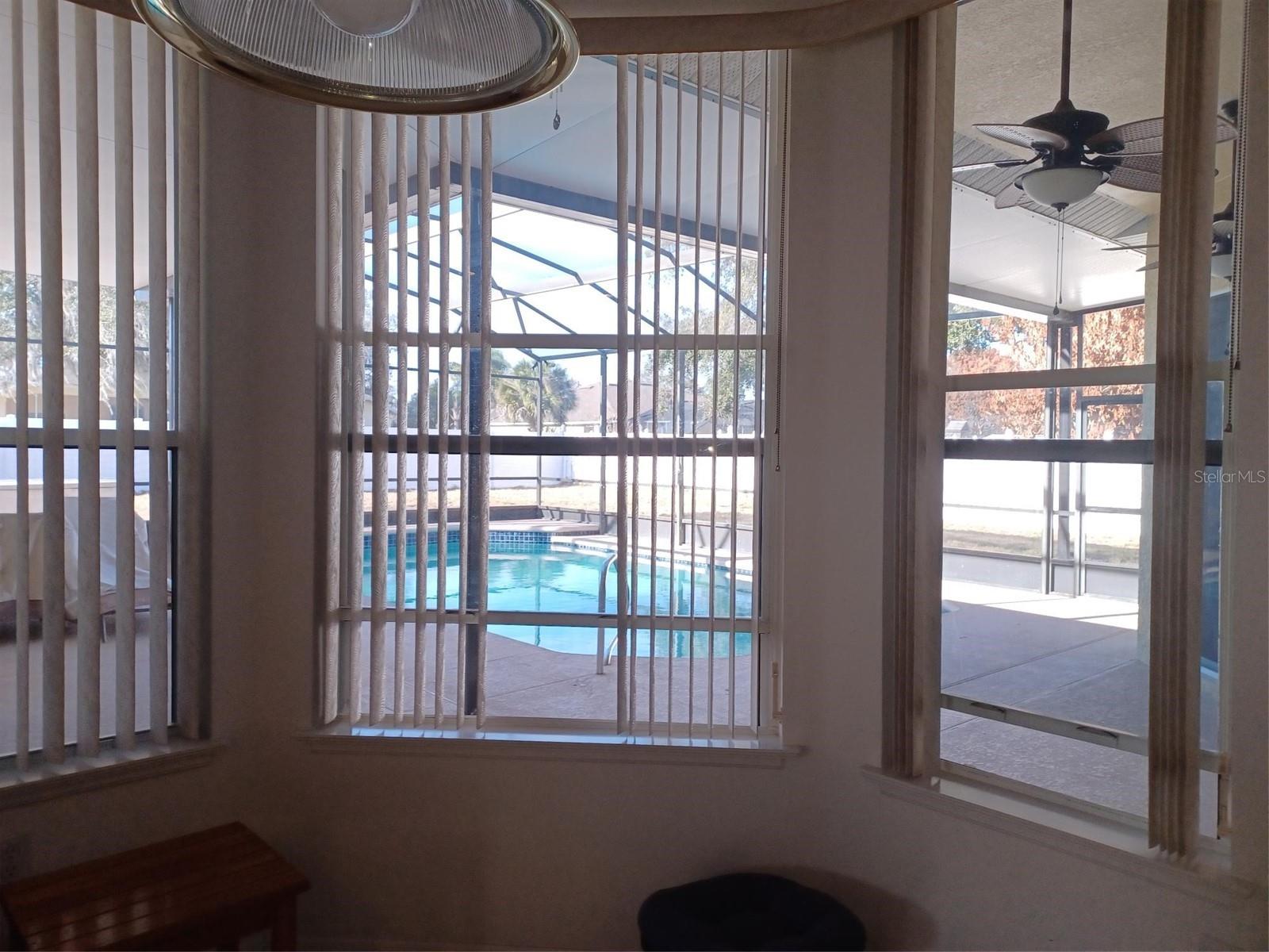 Kitchen area view of pool - 3513 BEAU CHENE DR, KISSIMMEE
