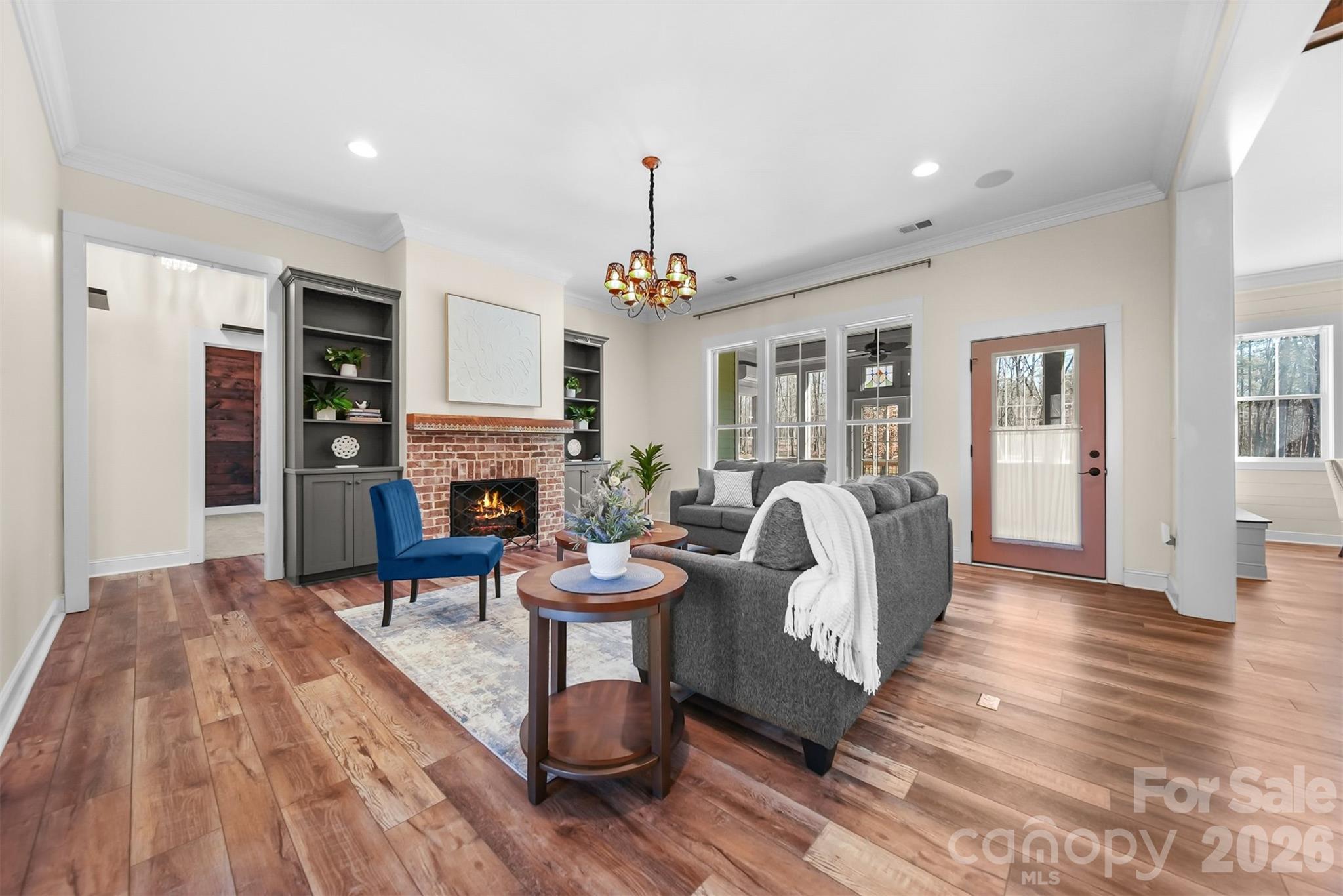 Great room with built in bookshelves and gas log fire place - 2586 Lee Lawing Road, Lincolnton