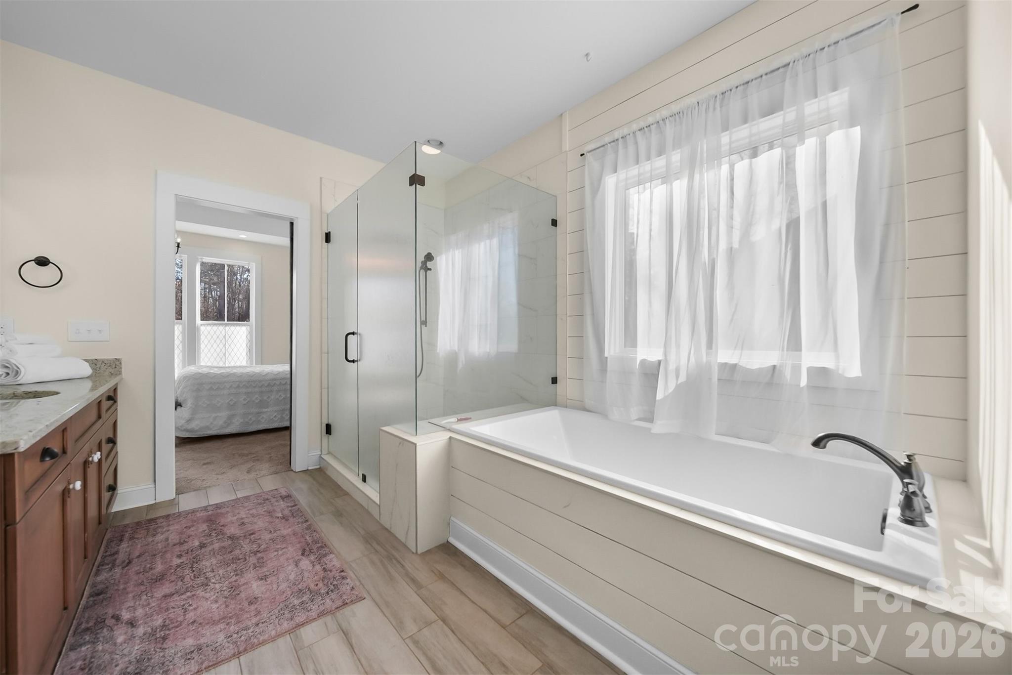 Primary Bath with extra large soaking tub and spacious walk in shower. - 2586 Lee Lawing Road, Lincolnton
