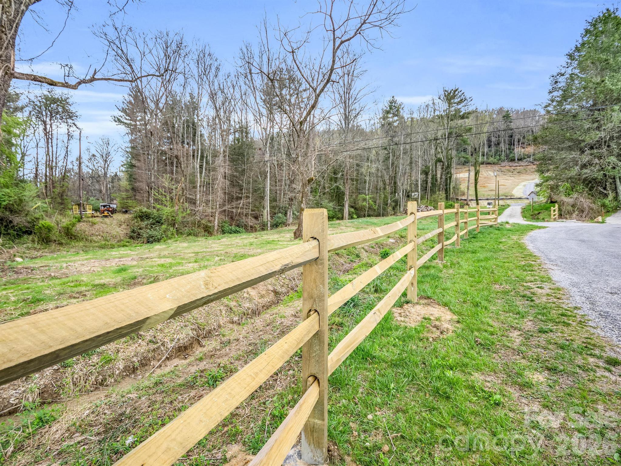 Fence added along road leading to property - 97 Yale Road, Hendersonville