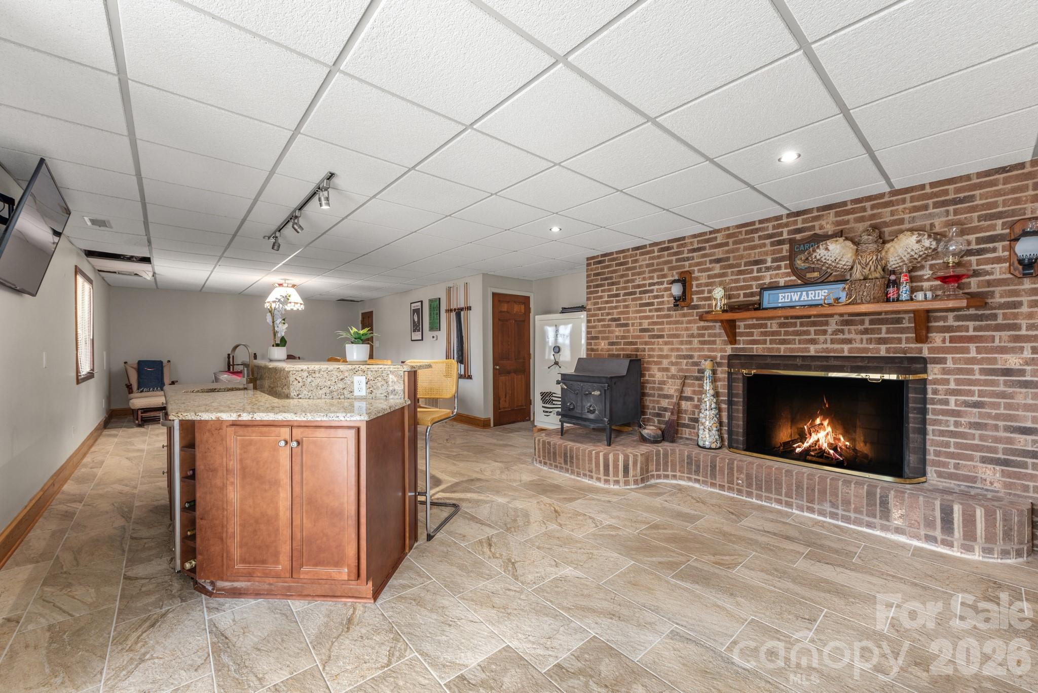 Bar area with fireplace - 151 Bridlewood Drive, Mooresville