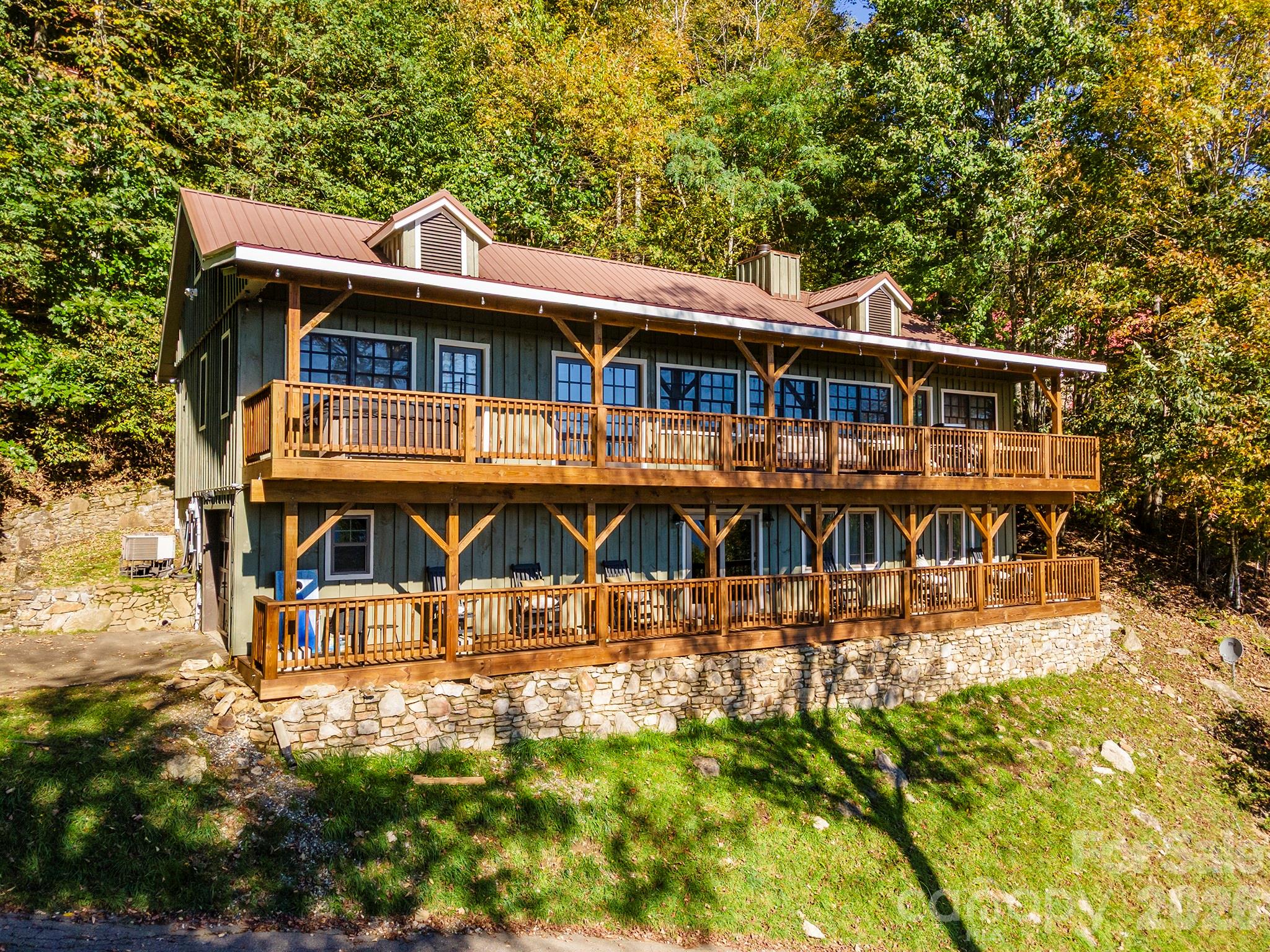 Pull up, take a deep breath, and smile — you’ve arrived somewhere special. From its inviting exterior to its cozy interior, this home is ready to be your next happy place. - 322 Goldenleaf Road, Mars Hill