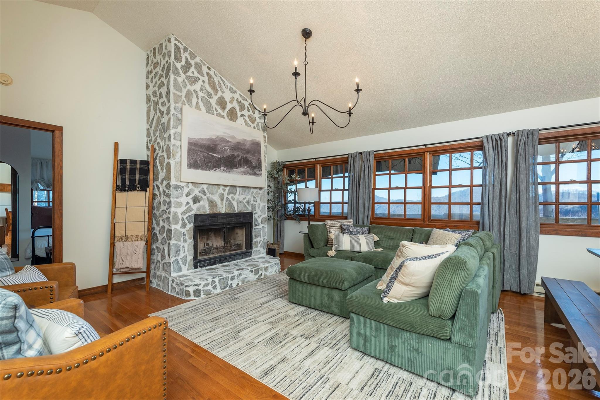Main floor living room. Step into the heart of the home. Our living area is designed for connection, comfort, and unforgettable moments. - 322 Goldenleaf Road, Mars Hill