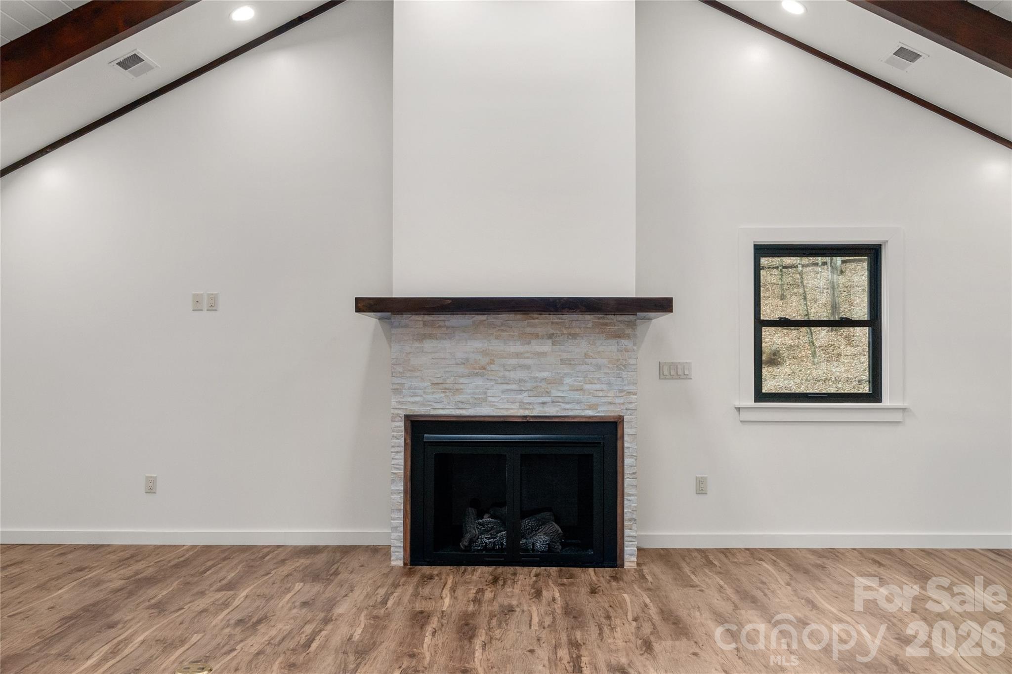 New gas fireplace and striking architectural details. - 453 Friendly Acres Drive, Waynesville