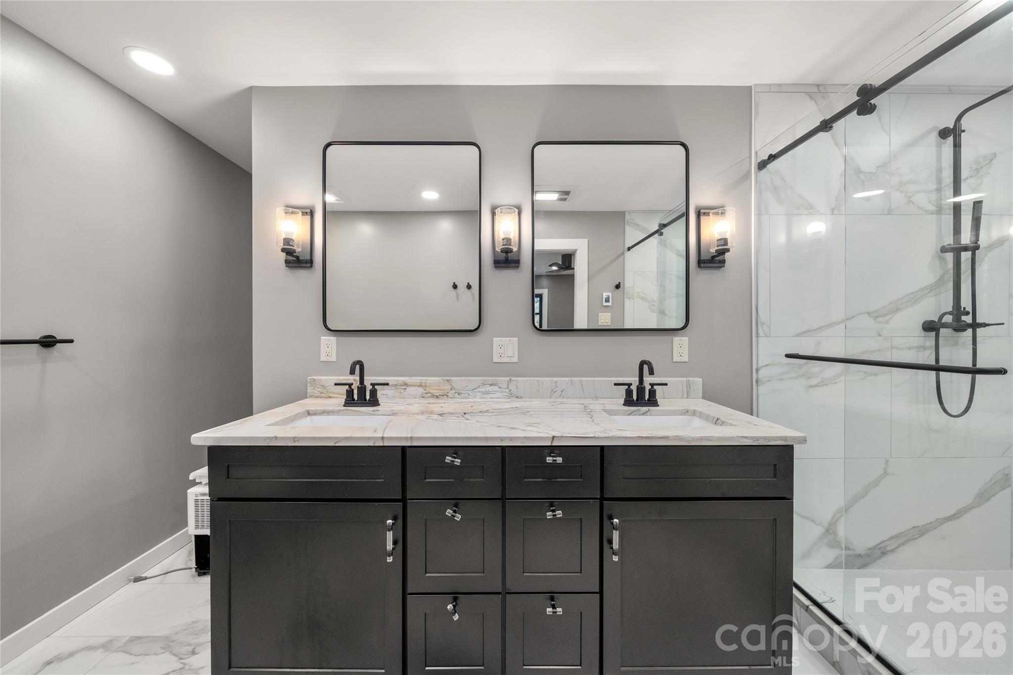 Fully renovated primary bath featuring heated floors for added comfort. - 453 Friendly Acres Drive, Waynesville
