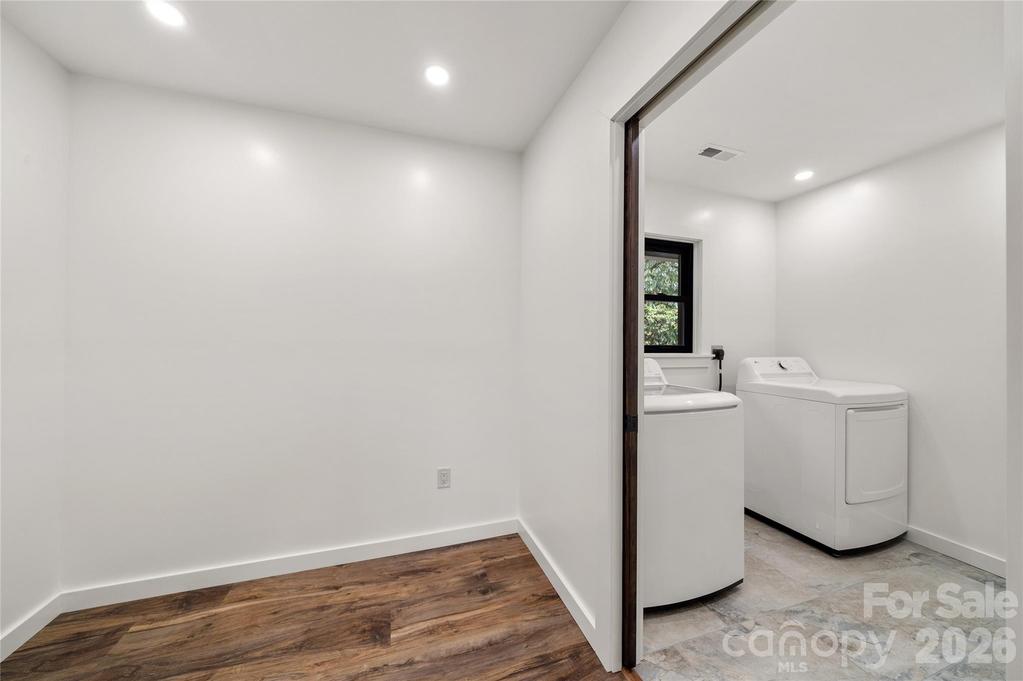 Main-level laundry room with washer and dryer included. - 453 Friendly Acres Drive, Waynesville