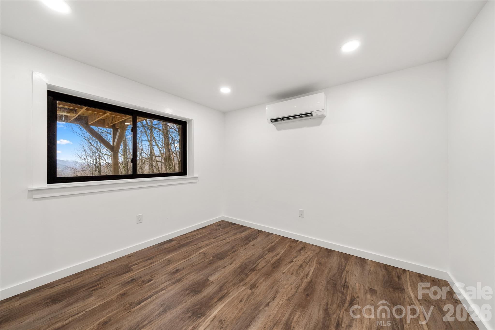 Downstairs/Basement 2nd Bedroom w/new flooring, lighting, windows - 453 Friendly Acres Drive, Waynesville