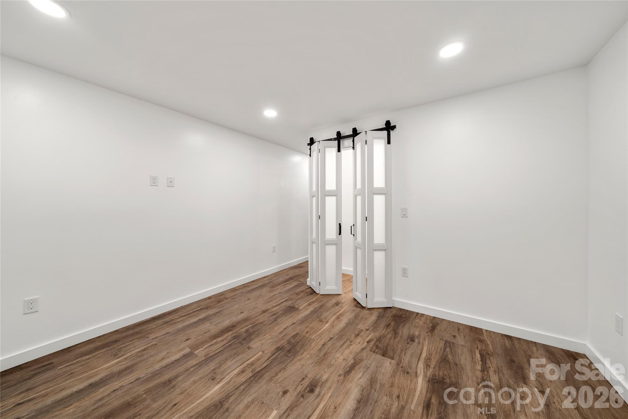 Downstairs/Basement 3rd Bedroom w/new flooring, lighting - 453 Friendly Acres Drive, Waynesville
