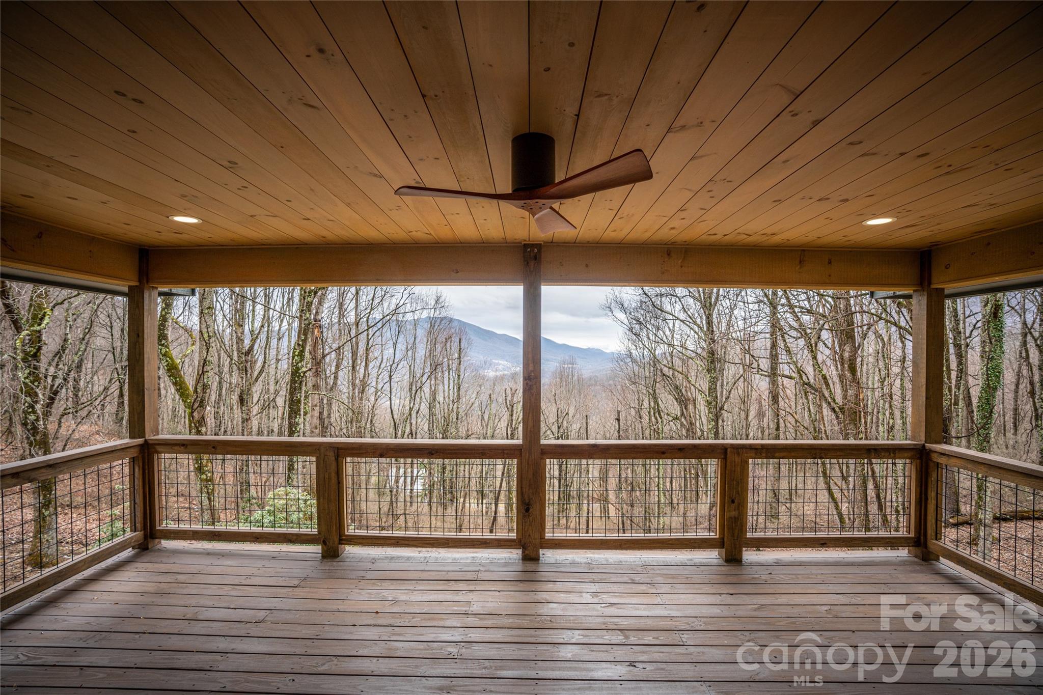 Spacious covered deck—perfect for year-round outdoor living and entertaining. - 453 Friendly Acres Drive, Waynesville