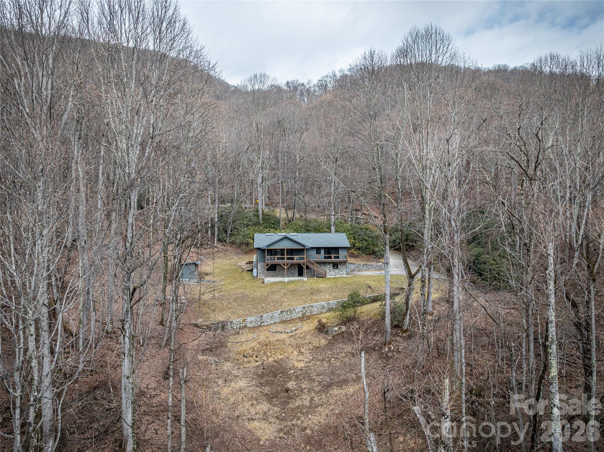 Just minutes from charming downtown Waynesville shops and dining. - 453 Friendly Acres Drive, Waynesville