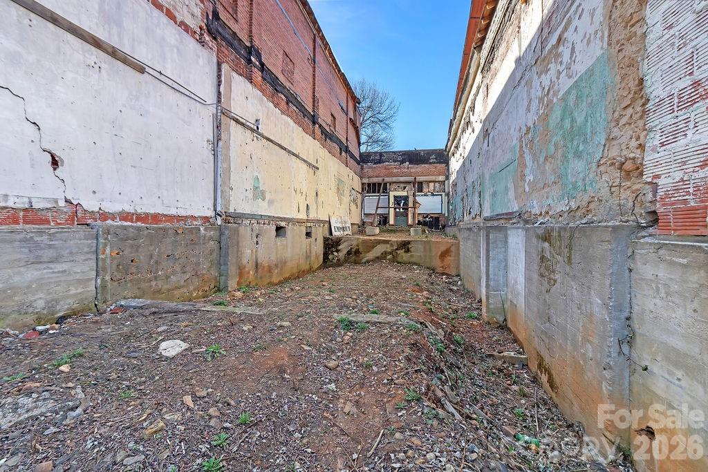 Back view of build site. - 46 W Main Street, Brevard