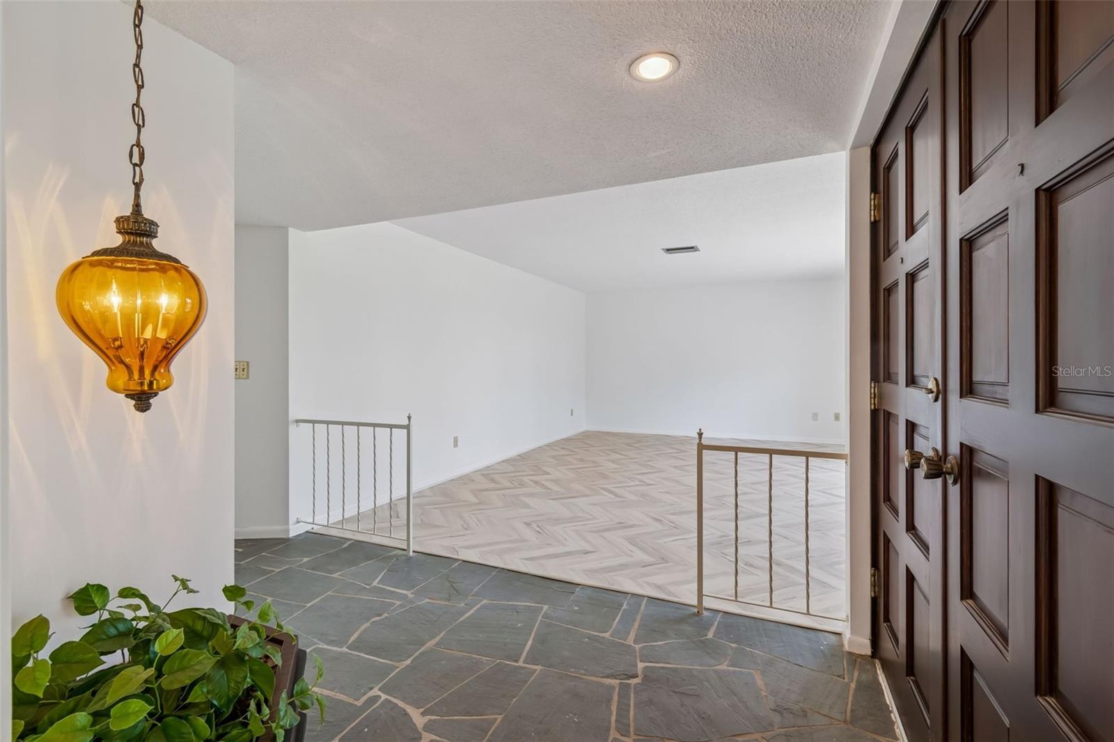 Large living room off foyer... - 4415 CLEARWATER HARBOR DR N, LARGO