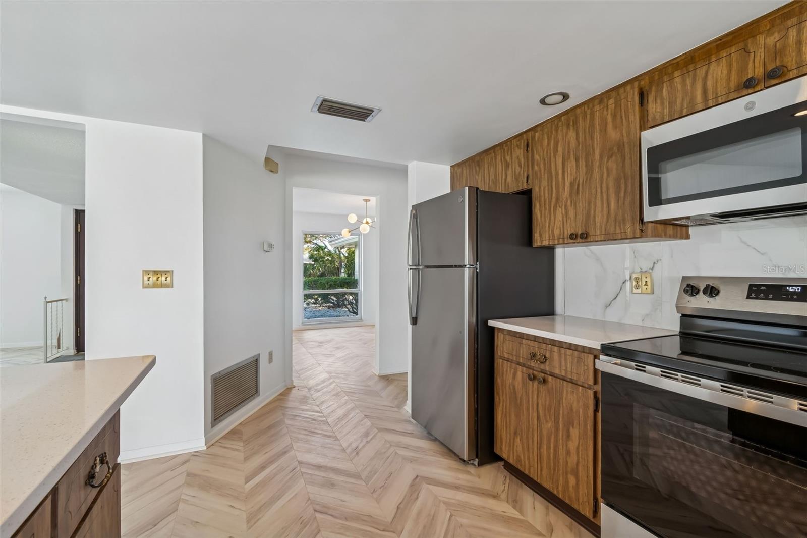 View of kitchen looking towards dining room - 4415 CLEARWATER HARBOR DR N, LARGO