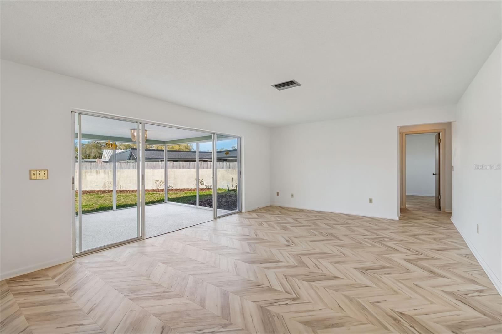 Sliders out to screened porch and leading out to dock! - 4415 CLEARWATER HARBOR DR N, LARGO