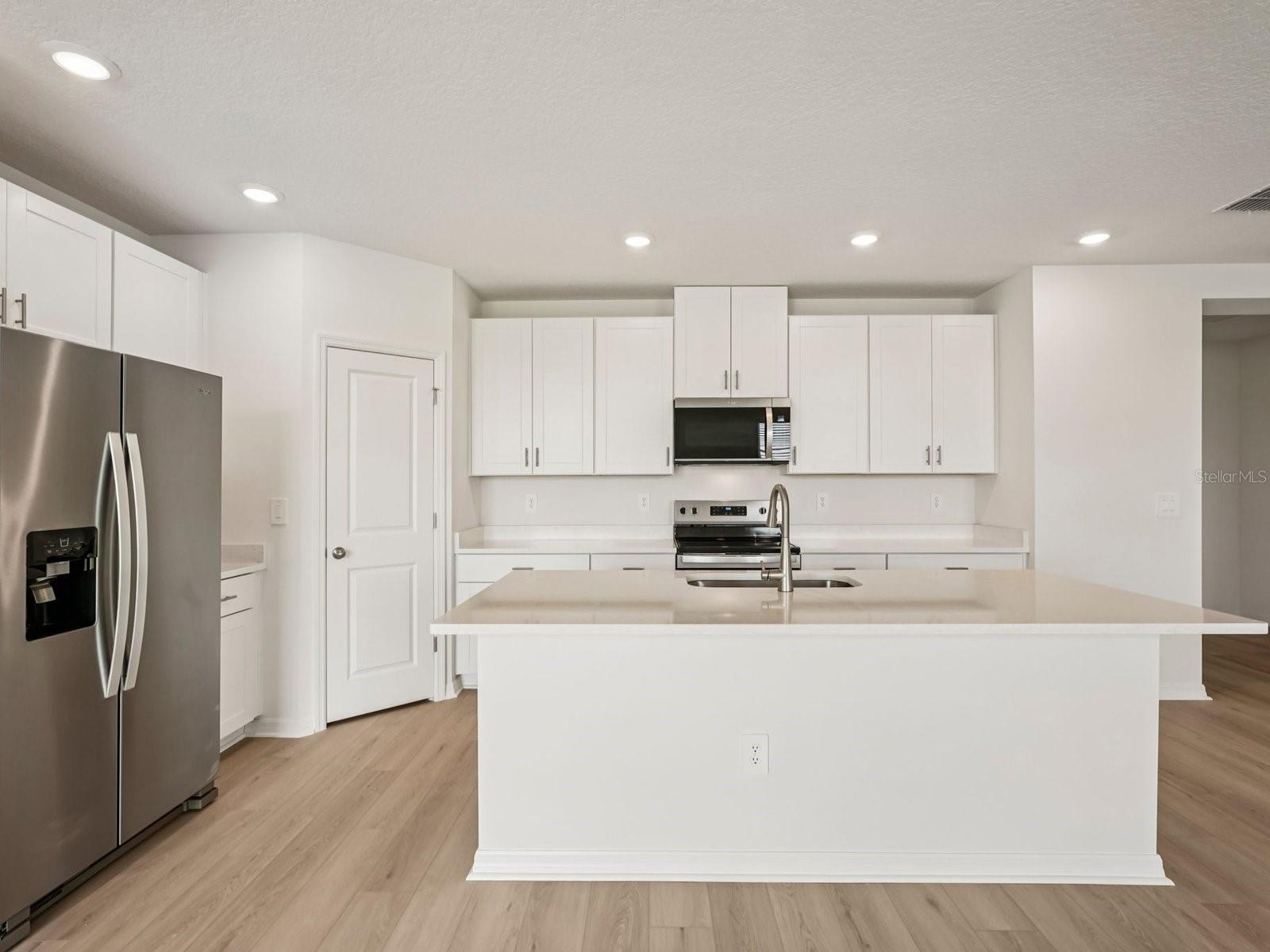 Interior photos are not of the actual home but are photos of the builder home with the same floorplan with similar interior finishes and features. - 10417 ABUNDANCE GROVE WAY, PARRISH