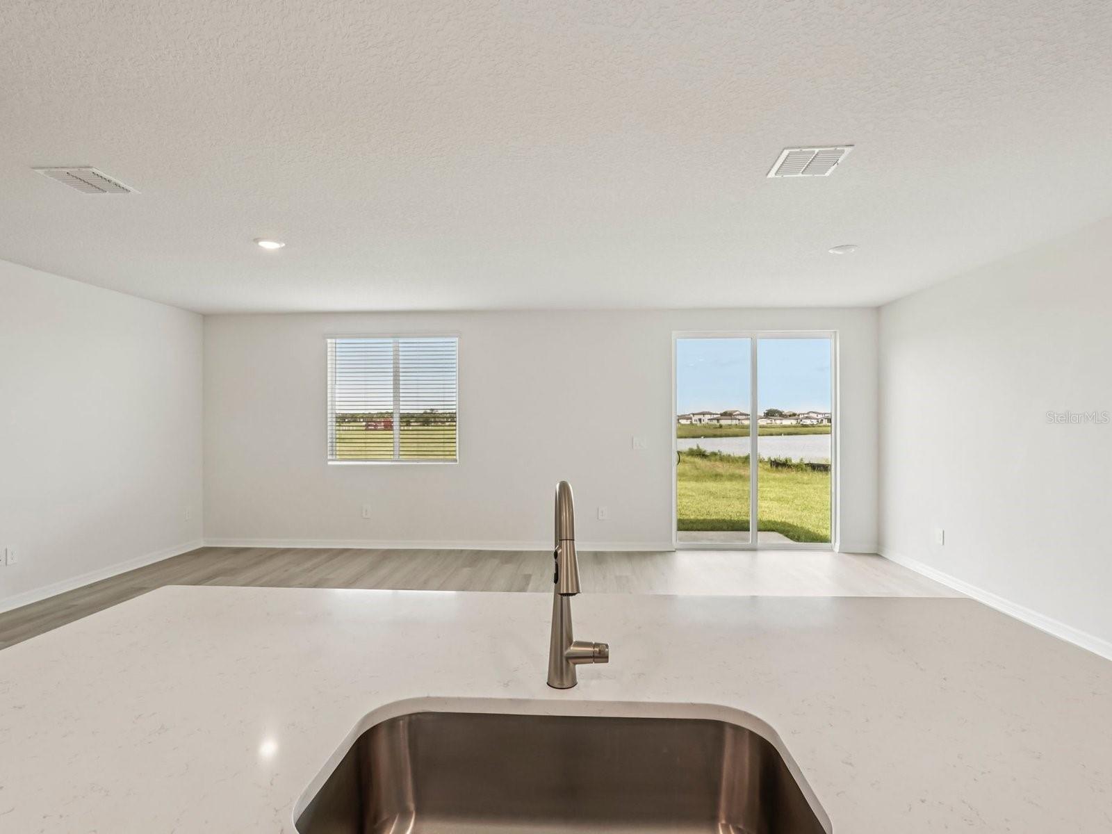 Interior photos are not of the actual home but are photos of the builder home with the same floorplan with similar interior finishes and features. - 10417 ABUNDANCE GROVE WAY, PARRISH