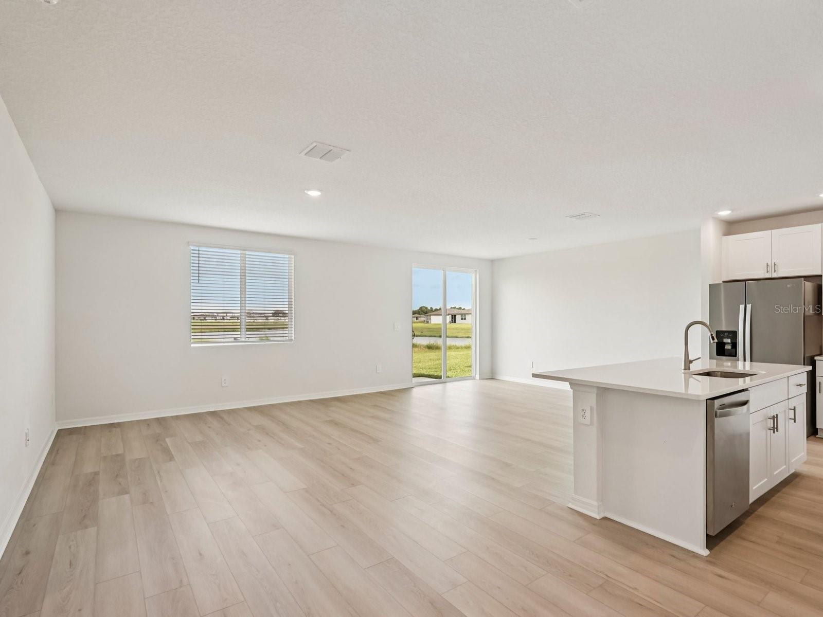 Interior photos are not of the actual home but are photos of the builder home with the same floorplan with similar interior finishes and features. - 10432 ABUNDANCE GROVE WAY, PARRISH