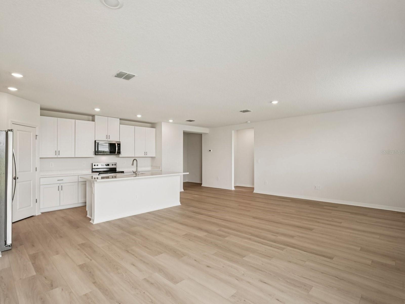 Interior photos are not of the actual home but are photos of the builder home with the same floorplan with similar interior finishes and features. - 10432 ABUNDANCE GROVE WAY, PARRISH