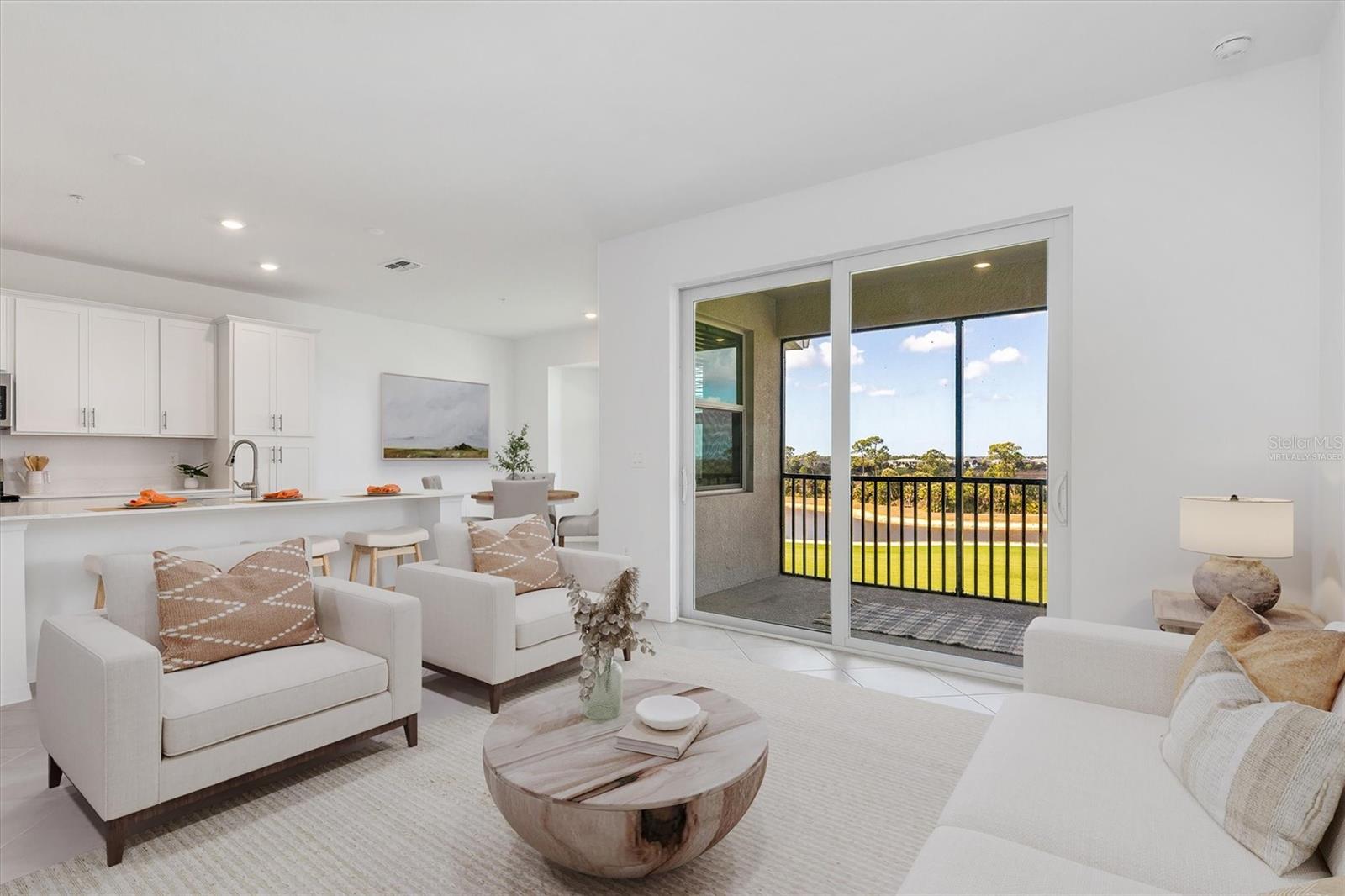 Virtually Staged Living Room - 17595 OPAL SAND DR #406, VENICE
