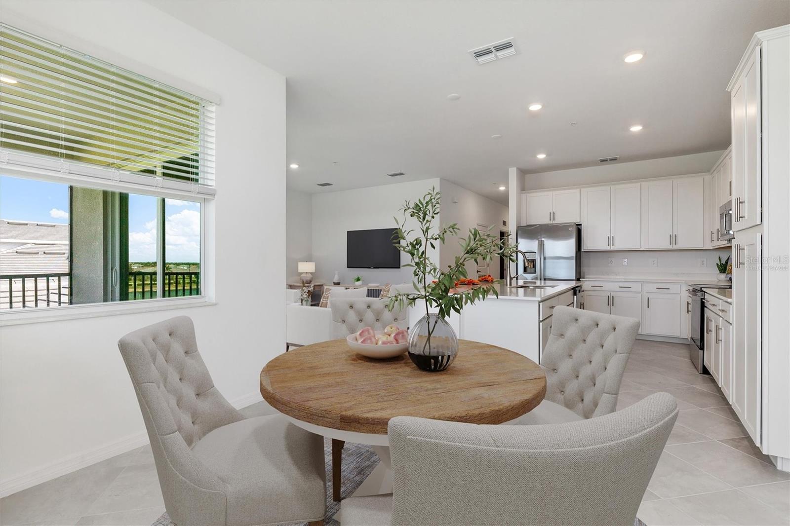 Virtually Staged Dining Room - 17595 OPAL SAND DR #406, VENICE