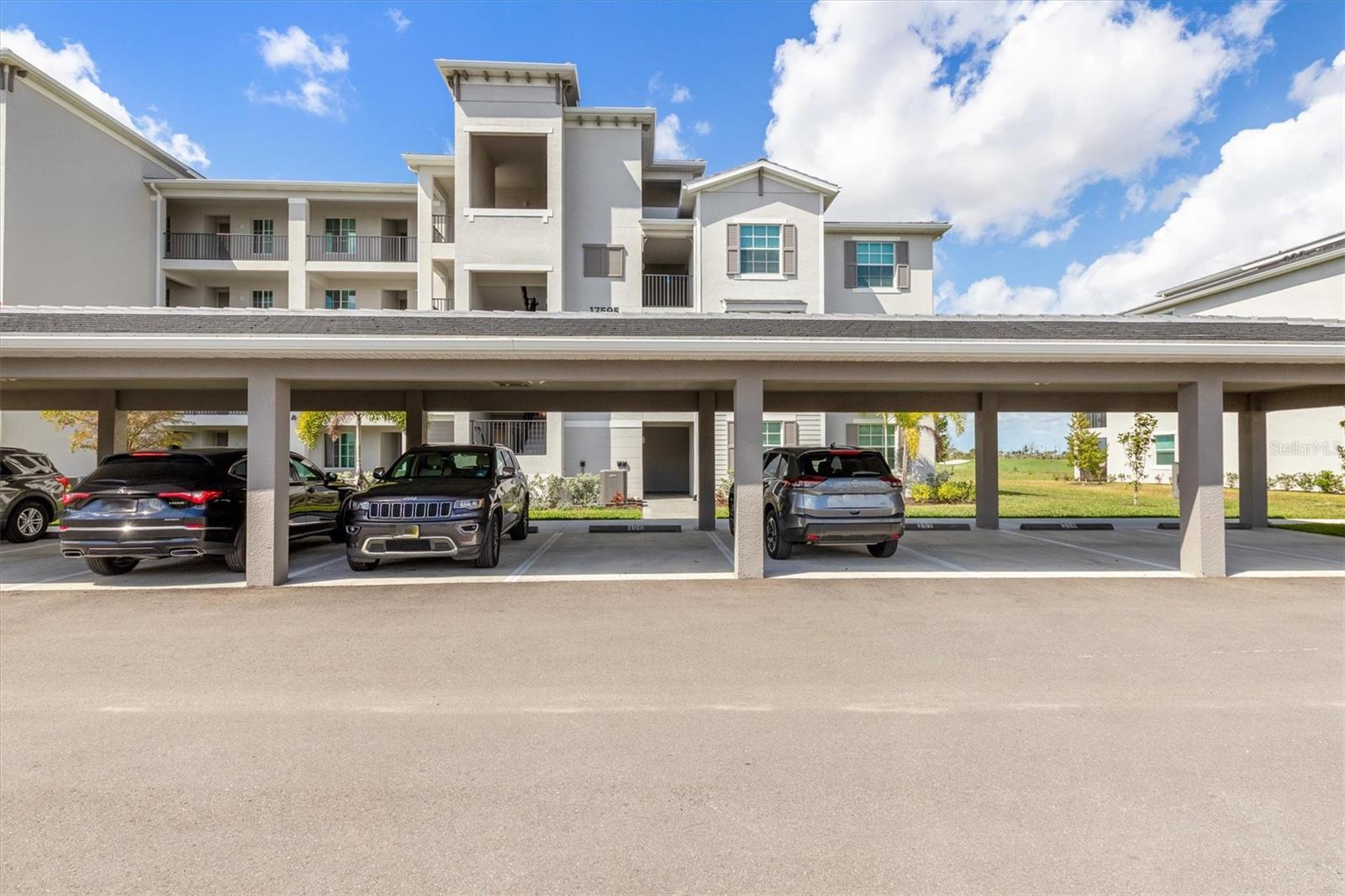 Assigned Carport plus plenty of guest parking - 17595 OPAL SAND DR #406, VENICE