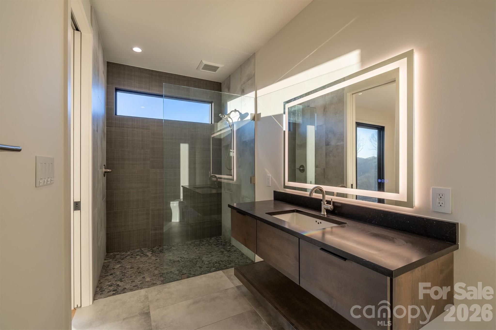 Ensuite baths for each lower level bedroom - 463 Summit Trail, Nebo