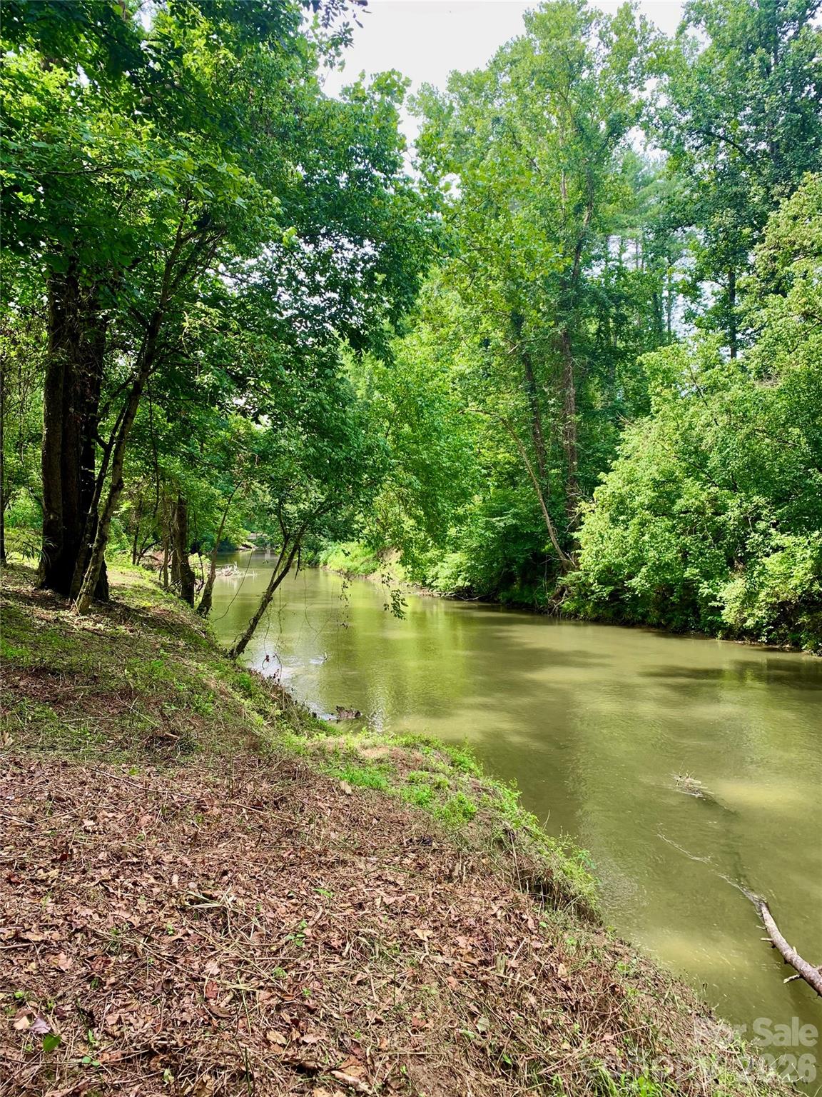 The property line follows center line of the Johns River - 5915 River Hollow Trail, Lenoir