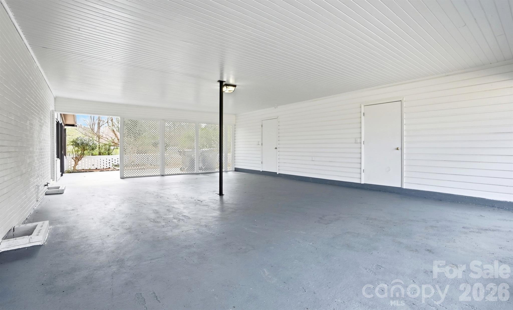 Carport with Storage Room - 125 Forest Hills Drive, Monroe