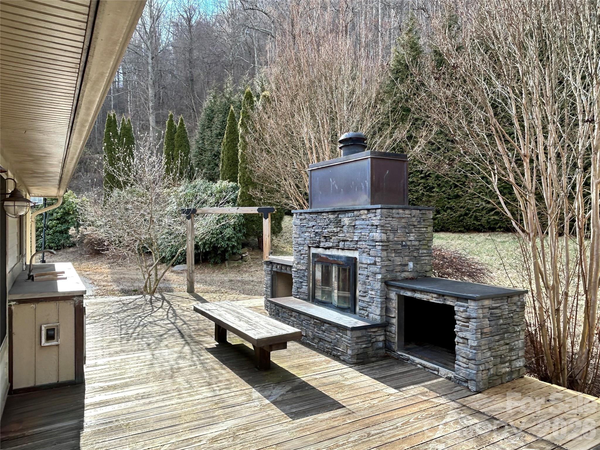 Outdoor kitchen and fireplace - 330 Potts Drive, Waynesville