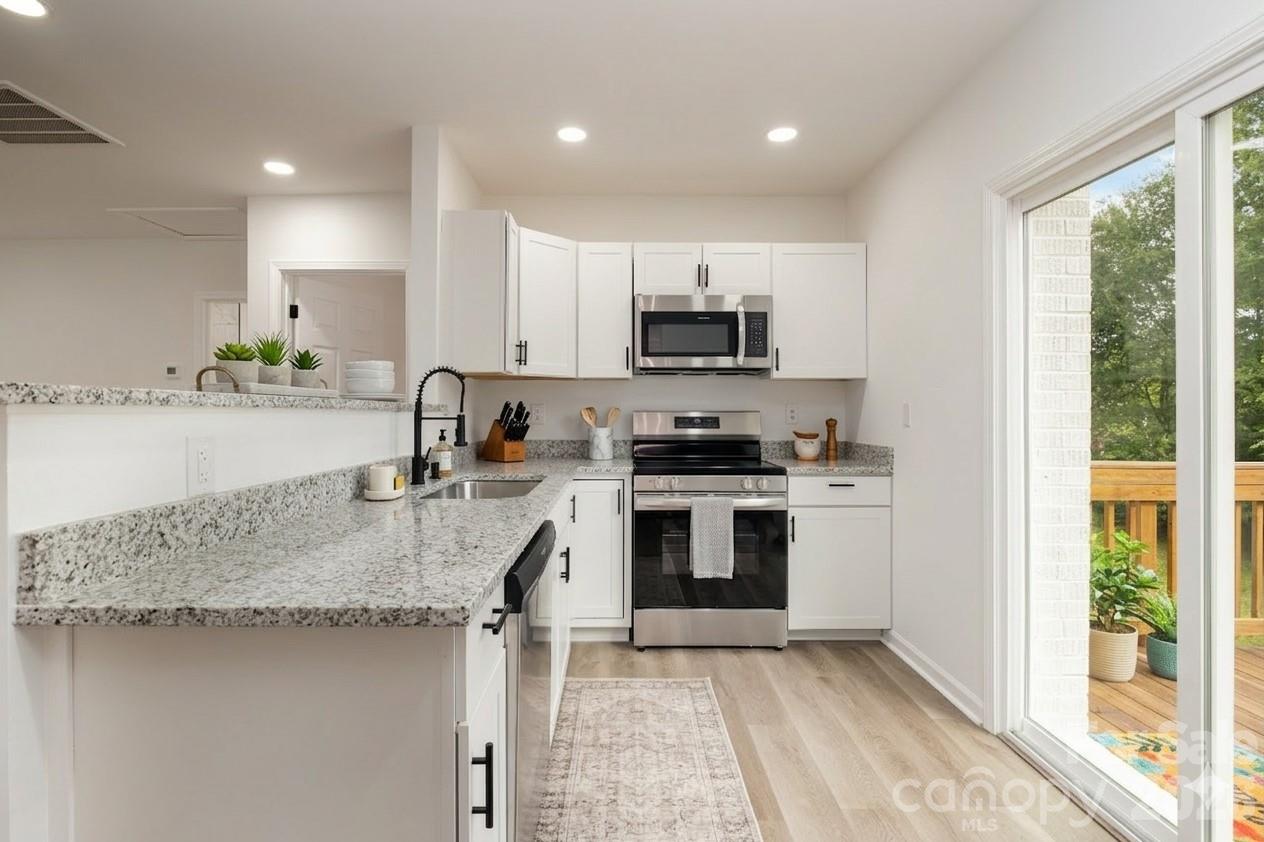 Kitchen with stainless appliances - 503 Circle Drive E, Shelby