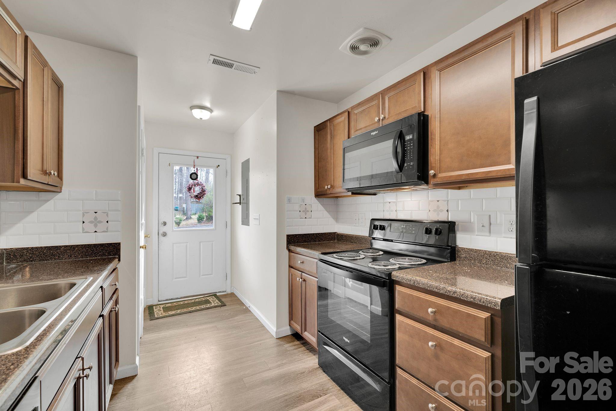 Walk through, galley kitchen. Appliances are recent. Pantry on left before exiting back door! - 372 E Mills Avenue, Mooresville