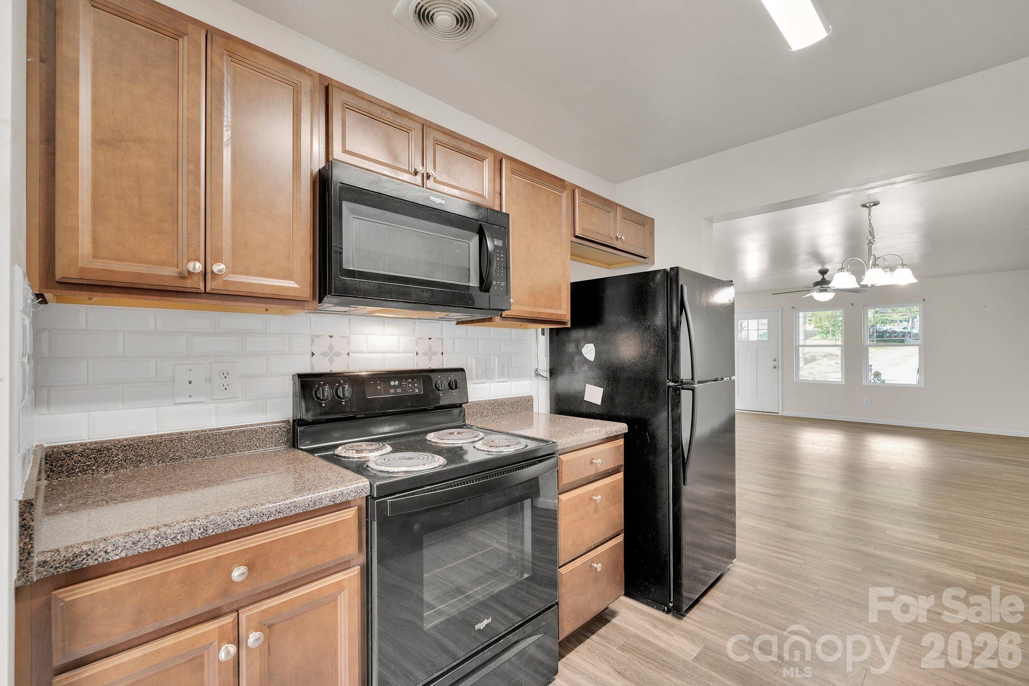 Walk through kitchen opens to Dining/Living area. - 372 E Mills Avenue, Mooresville