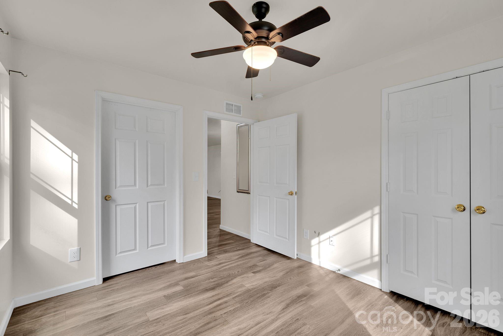 Primary bedroom on main with direct access to the full bathroom. - 372 E Mills Avenue, Mooresville